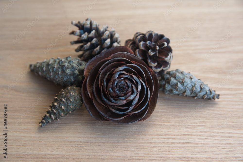 Christmas decor with conifer, cedar, pine cones, on wooden background Christmas decor with conifer, cedar, pine cones, on wooden background