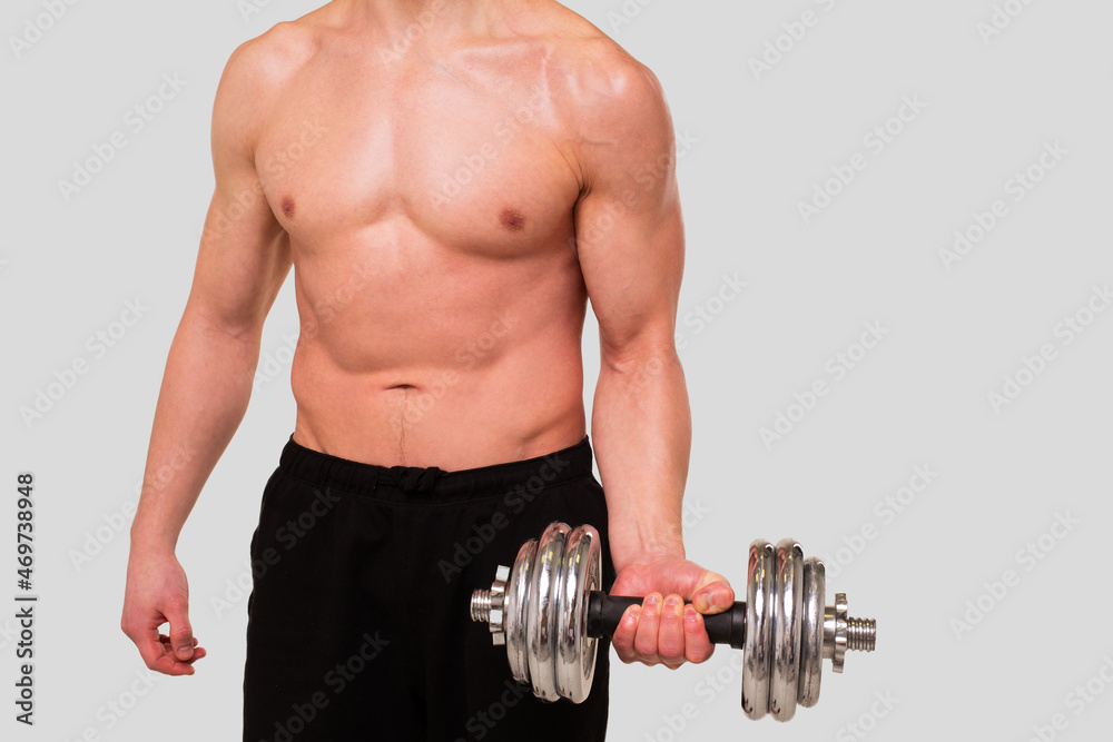 Man Topless Pumping Biceps with Dumbbell. Sprotsman Doing Training on Biceps Muscles. Gym, Lifting Sport Concept. Close Up