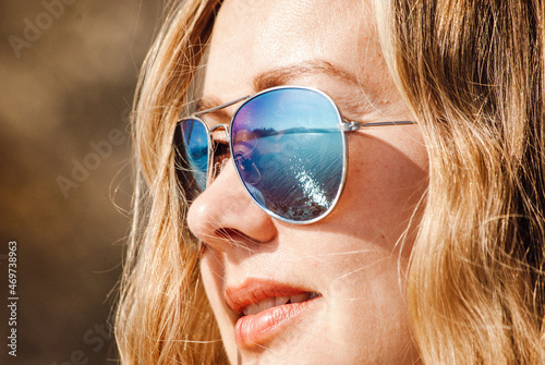 Closeup portrait of beautiful women with sunglasses with reflection