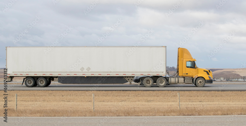 Heavy Cargo on the Road. A truck hauling freight along a highway