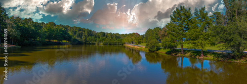 Εκτύπωση καμβά a stunning aerial panoramic shot of the still green lake surrounded by lush gree