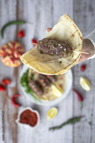 Traditional homemade kafta or kofta kebab with tomato sauce and yoghurt photo