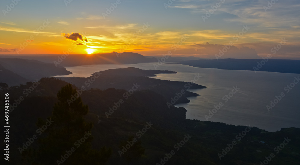 Fototapeta premium The beauty of Lake Toba which is a caldera lake comes from an ancient volcanic eruption and is the largest volcanic lake in the world. View from geosite hutaginjang. North Sumatra, Indonesia