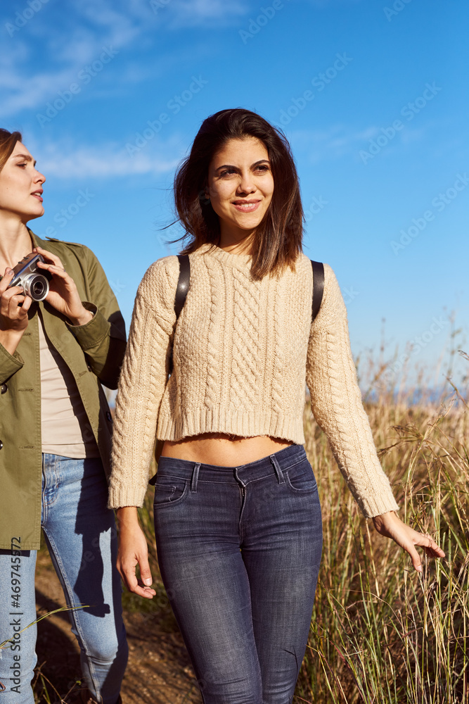 Female friends walking in mountains together