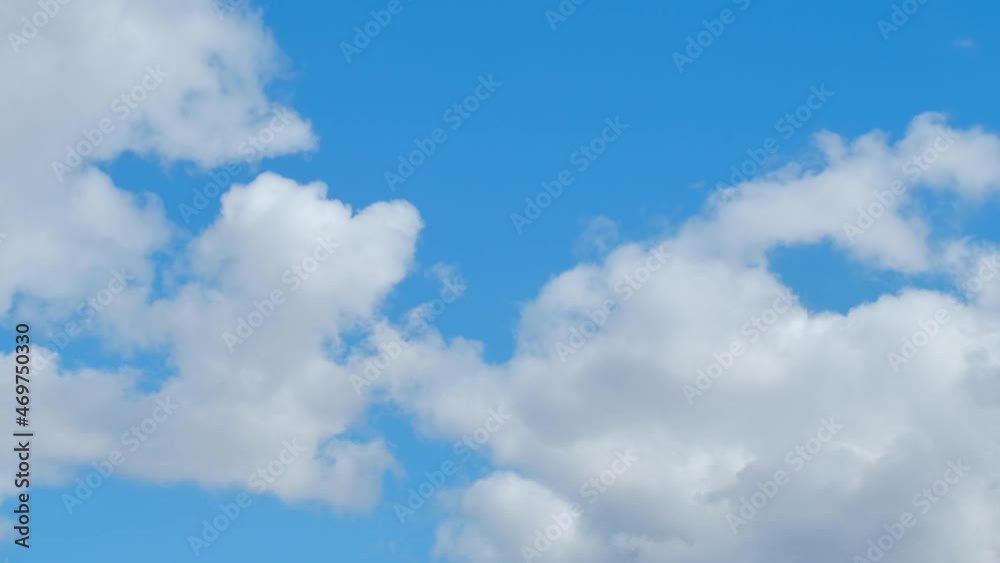 white fluffy clouds flying across the blue sky. time-lapse white fluffy clouds flying across the blue sky. time-lapse