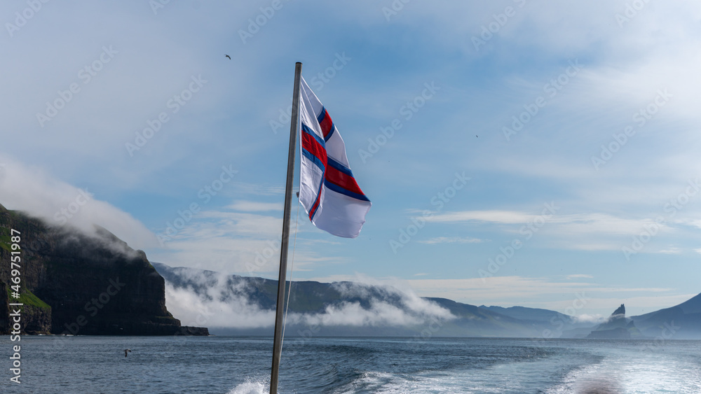 The Faroe Islands Flag, with its White and cross Red a blue stripes 