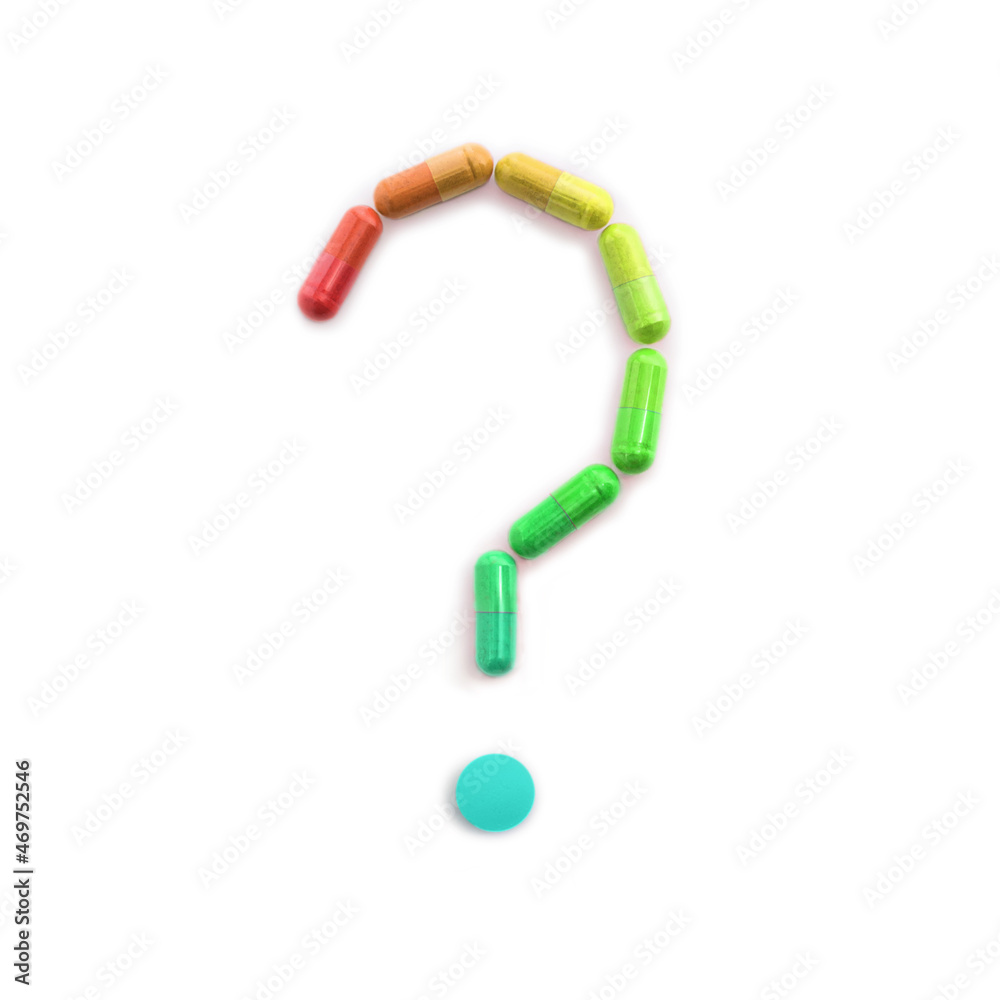 Question Mark Made of Tablets Conceptual health and nutrition image. A selection of multicolored tablets arranged into the shape of a question mark. Question Mark Made of Tablets Conceptual health and nutrition image. A selection of multicolored tablets arranged into the shape of a question mark.