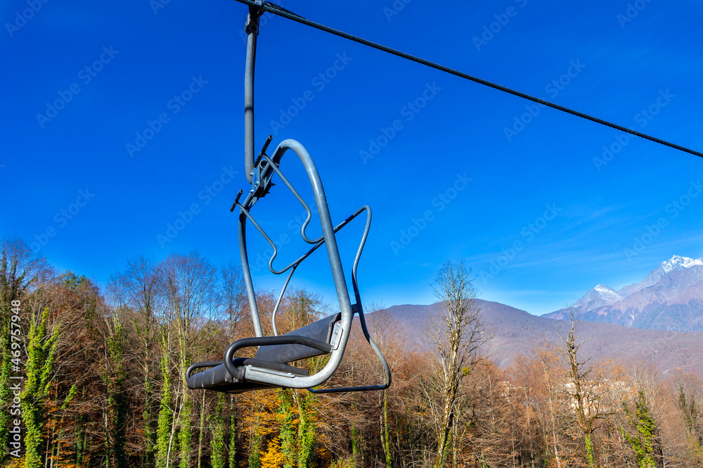 Funicular panorama in the mountains. Open cabins. Cable car Sochi Krasnaya Polyana. Autumn in the mountains Funicular panorama in the mountains. Open cabins. Cable car Sochi Krasnaya Polyana. Autumn in the mountains