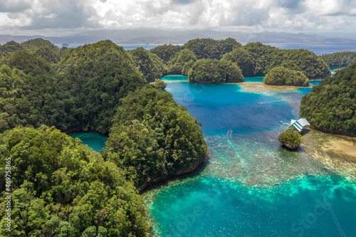 Aerial shot a Limestone islands form a remote lagoon in northern Raja Ampat, Indonesia.