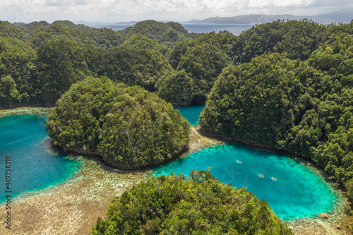 Fototapeta Naklejka Na Ścianę i Meble -  Aerial shot a Pianemo Islands, Blue Lagoon with Green Rockes, Raja Ampat, West Papua, Indonesia.