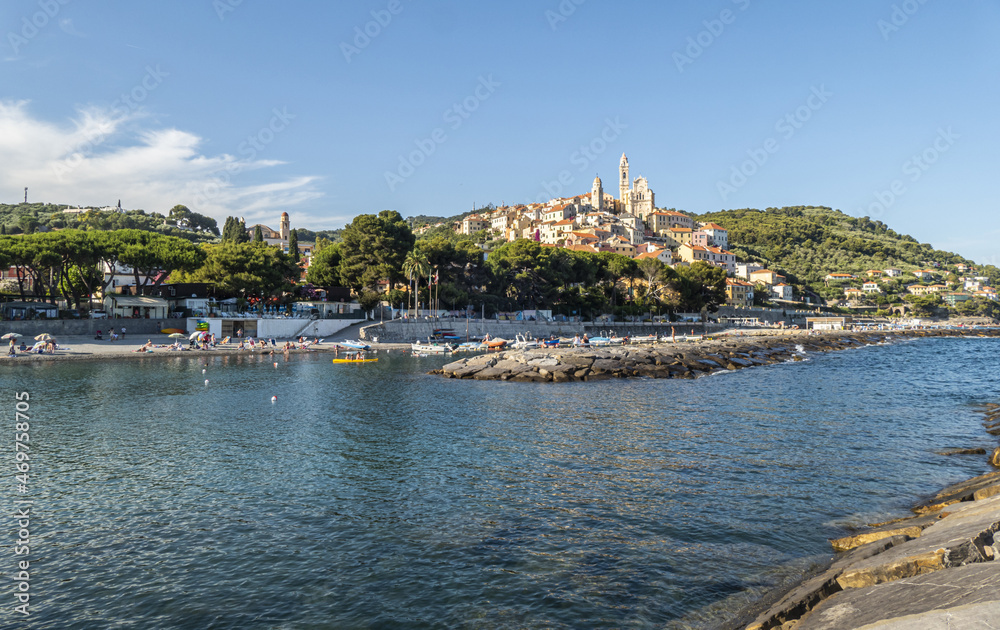 Cervo beach with its characteristic rocks and the beautiful town in the background