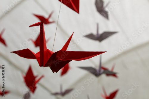 origami birds on a red background
