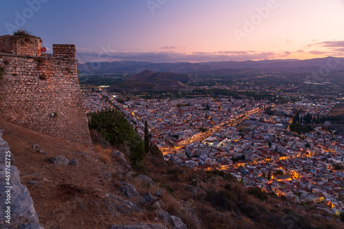 Cityscape of Nafplio town shortly before sunrise from the hill of ancient Greek fortress Palamidi