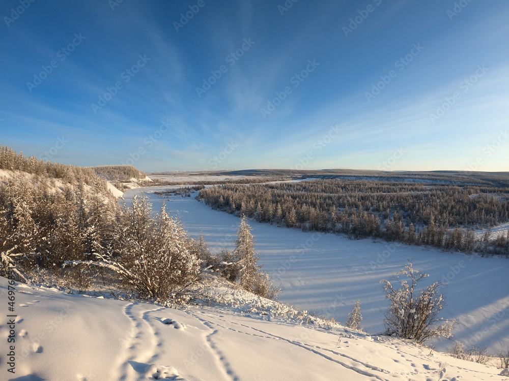 Winter landscape, snow covered Kolyma river in Kolyma, Yakutia, Russia Winter landscape, snow covered Kolyma river in Kolyma, Yakutia, Russia