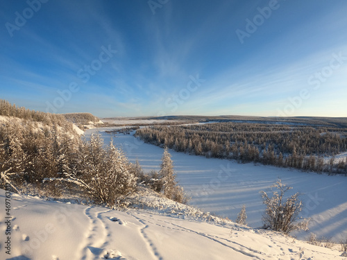 Winter landscape, snow covered Kolyma river in Kolyma, Yakutia, Russia photo