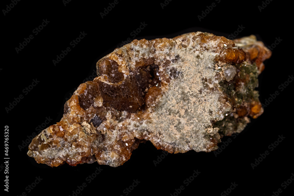 macro mineral stone Grossular, Garnet, Epidote on a black background macro mineral stone Grossular, Garnet, Epidote on a black background