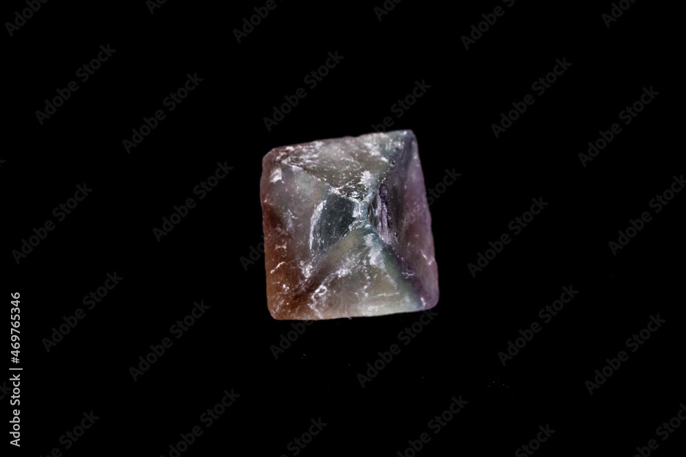 macro mineral fluorite stone on balck background