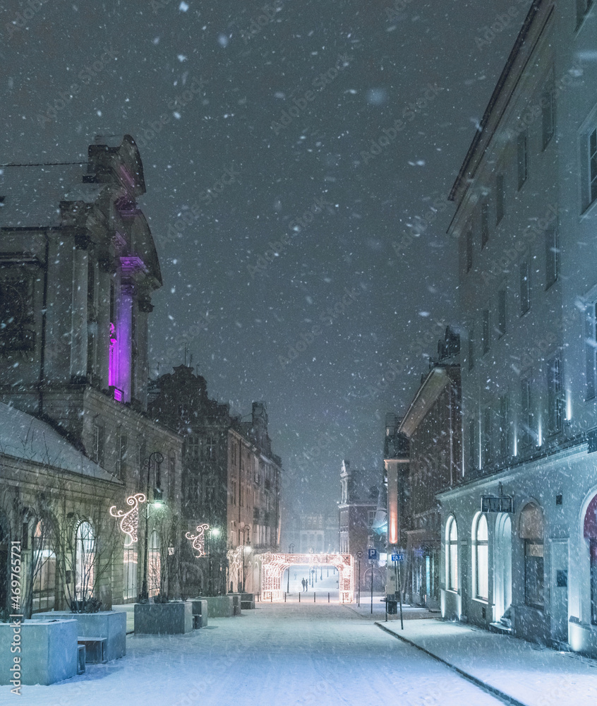 Late-night snowing at the Old Town square in Poznan, Poland