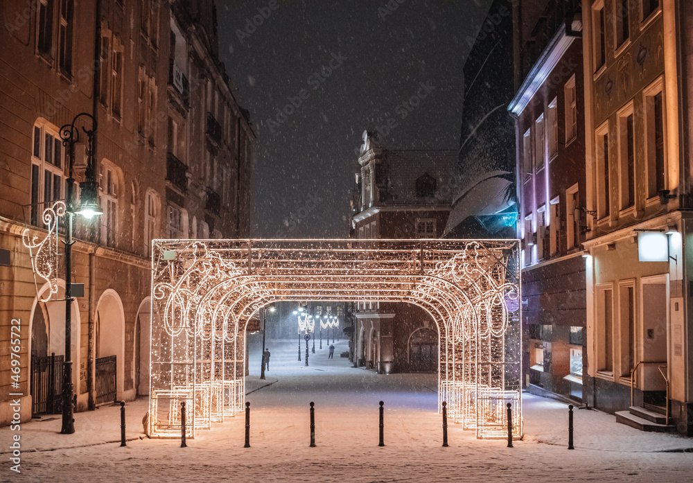 Late-night snowing at the Old Town square in Poznan, Poland