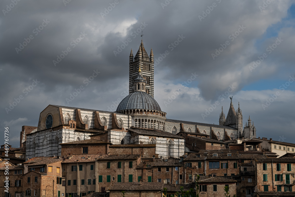 The Duomo of Siena, Cattedrale Metropolitana di Santa Maria Assunta, Evening Light with dramatic sky.