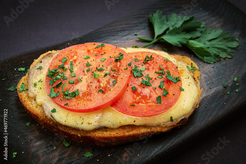 hot open sandwich with cheese, tomato and ham