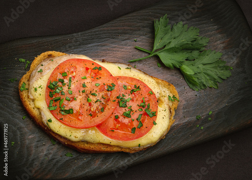 hot open sandwich with cheese, tomato and ham