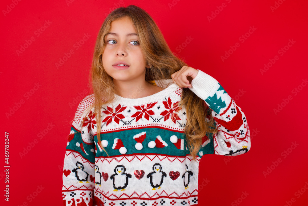 little kid girl wearing knitted sweater christmas over red background stressed, anxious, tired and frustrated, pulling shirt neck, looking frustrated with problem little kid girl wearing knitted sweater christmas over red background stressed, anxious, tired and frustrated, pulling shirt neck, looking frustrated with problem
