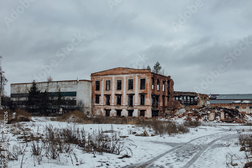 Remains of demolished old industrial building. Pile of stones, bricks and debris