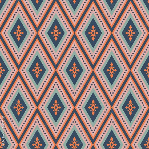 Colorful boho southwest seamless vector pattern. Navy blue, orange, pink and green bohemian style geometric diamond design. Decorative print with western shapes. Repeat background surface texture.