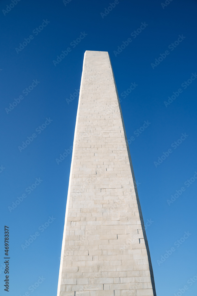 Panoramic view of the marble granite obelisk, an ancient monument made of stone. Minimalist frame of architecture.