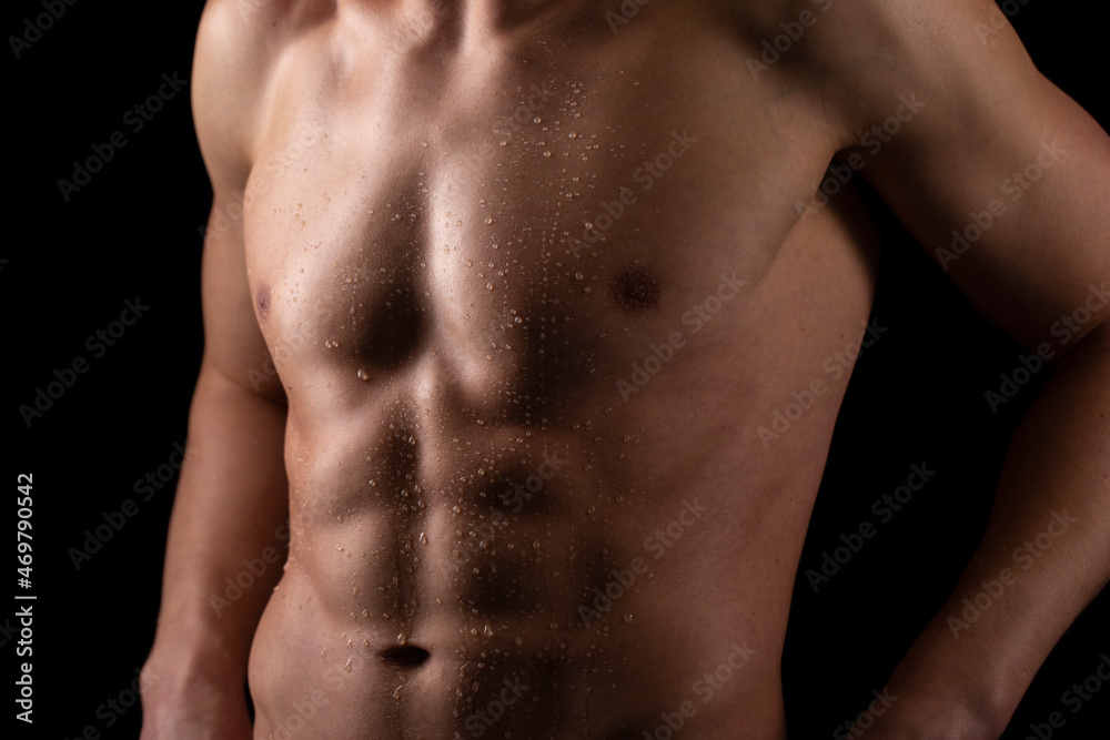 Man Showing ABS. Muscle man Posing. Strong Body Concept. Topless Sportman Bodybuilder. Six Pack Man Showing ABS. Muscle man Posing. Strong Body Concept. Topless Sportman Bodybuilder. Six Pack