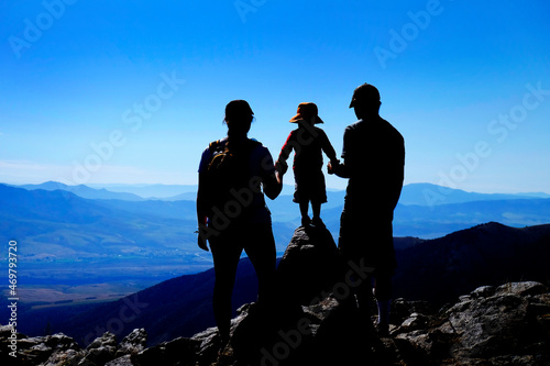 Family on Mountain Top Silhouette Success and Happiness