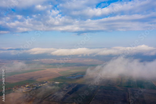 Aerial view of Natural sky and clouds background. Cloudy over the city. Flying high above the clouds.