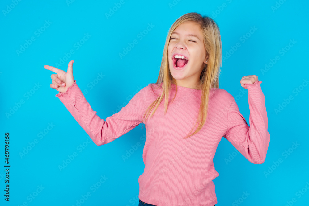 Cheerful MODEL showing copy space ad celebrating luck Cheerful MODEL showing copy space ad celebrating luck