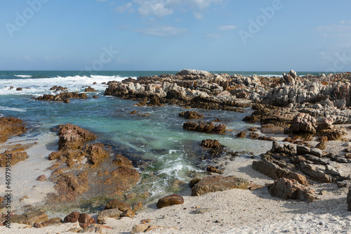 Rock pools and jagged coastline rocks on a beach, the Atlantic coast.