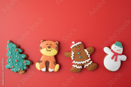 Set of traditional Christmas gingerbread on bright red background party banner. Copy space.