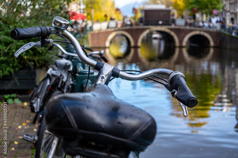 bycicle handlebars and bridge in Amsterdam