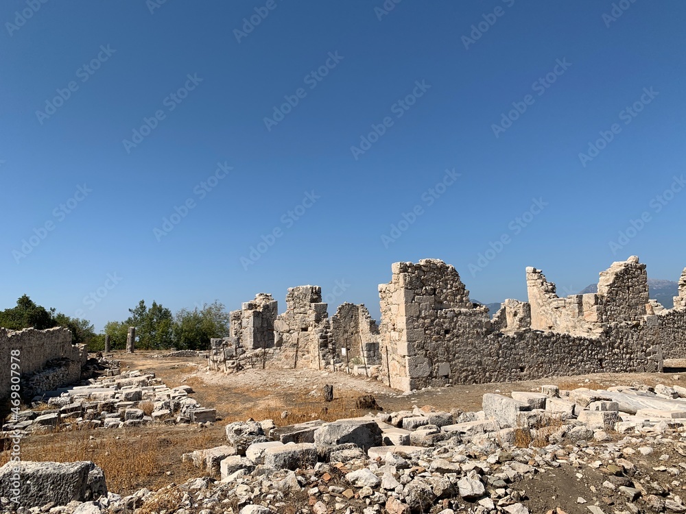 Ruins of an ancient amphitheater. Roman amphitheater in Turkey.Ancient stones of the excavated historic city. Turkey, Fetiya, August 13, 2021 Ruins of an ancient amphitheater. Roman amphitheater in Turkey.Ancient stones of the excavated historic city. Turkey, Fetiya, August 13, 2021