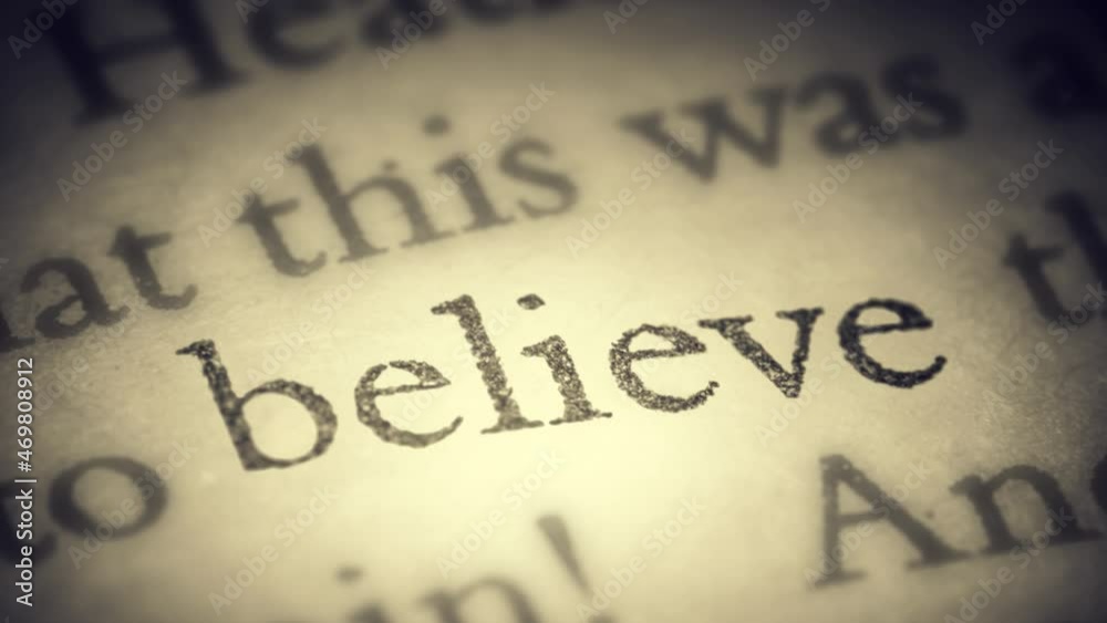 The word believe on an old page in the book is separated from the general text and zooms into the camera. Creative 3D 4k slow motion video animation.