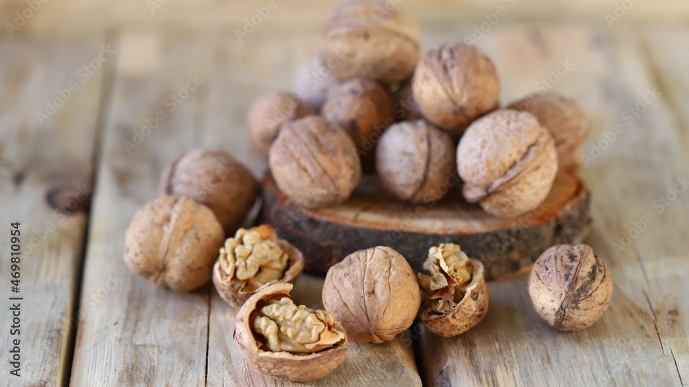 Selective focus. Walnuts on a wooden surface. Selective focus. Walnuts on a wooden surface.