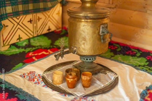 Fototapeta Naklejka Na Ścianę i Meble -  Russian samovar and a tray with cups.