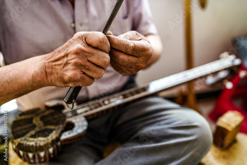 Handmade national stringed instrument culture photo