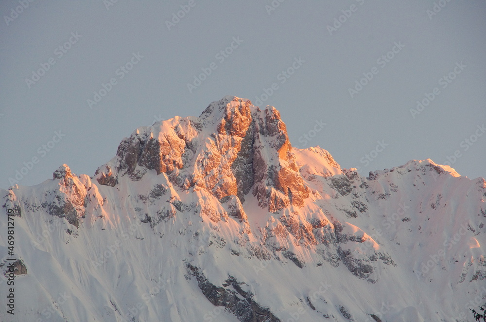 A sunrise in Dolomite mountains, view of a rocky mountain top