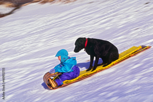 Bucky Brownell (R) tobogganing with Kodak in Andover, NH USA photo