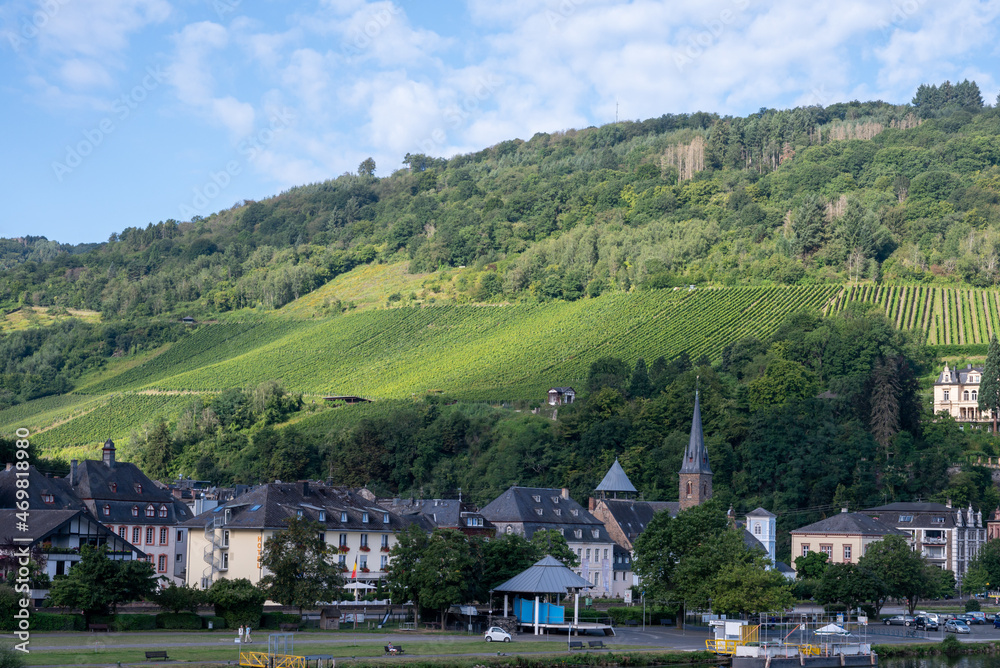 View on Mosel river, hills with vineyards and old town Traben-Trarbach, Germany