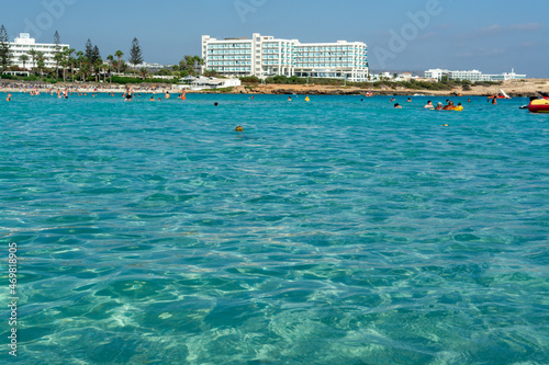 Crystal clear blue water of Mediterranean sea on Nissi beach in Ayia Napa, Cyprus © barmalini