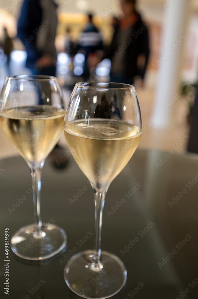 Tasting of brut champagne sparkling wine during visit caves in champagne house in Reims, France