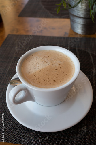 White cup of italian coffee cappuccino