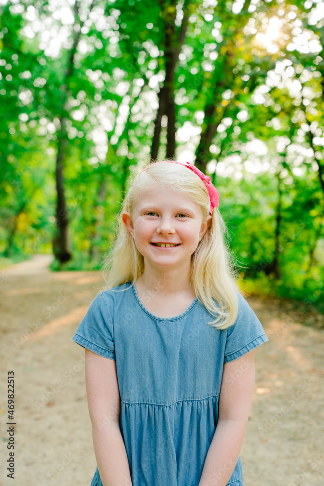 Closeup portrait of a happy young girl on a hiking trail Closeup portrait of a happy young girl on a hiking trail
