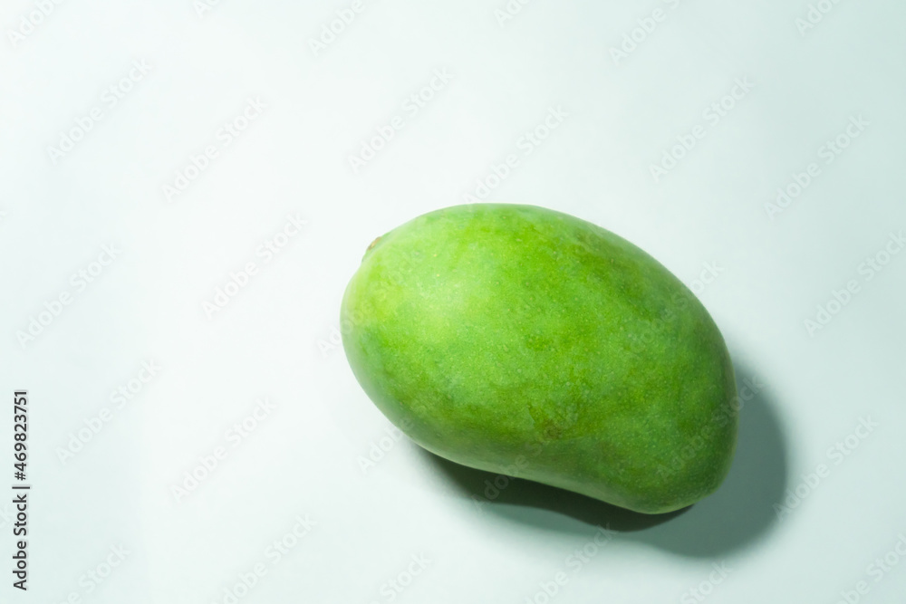 Delicious green mango fruit isolated on a white background Delicious green mango fruit isolated on a white background